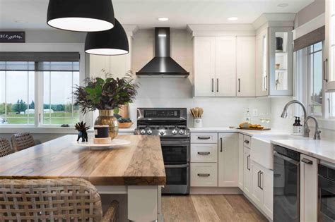 white kitchen black stainless appliances